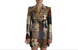 A model wearing a patchwork quilted blazer with a multicolor print of various fabrics, including floral, paisley, and polka dot patterns, shown against a plain white background.