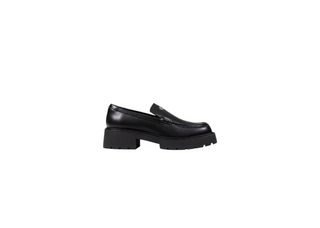 A single black leather loafer with a chunky block heel and a small metallic tassel detail on the vamp, shown from a side profile against a solid white background.