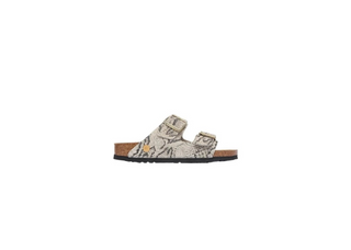 A single slip-on sandal with a beige and brown snakeskin patterned upper and a brown cork-look midsole, shown against a plain white background.