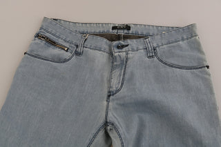 Jeans ajustados de mezclilla azul claro de talle medio