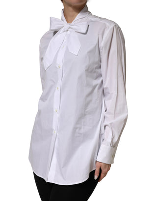 Blusa blanca de algodón con lazo y mangas largas