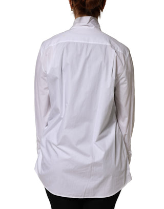 Blusa blanca de algodón con lazo y mangas largas