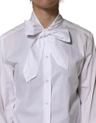 Blusa blanca de algodón con lazo y mangas largas