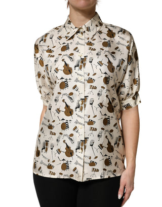 Top beige de manga corta con estampado de instrumentos musicales