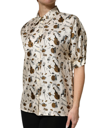 Top beige de manga corta con estampado de instrumentos musicales