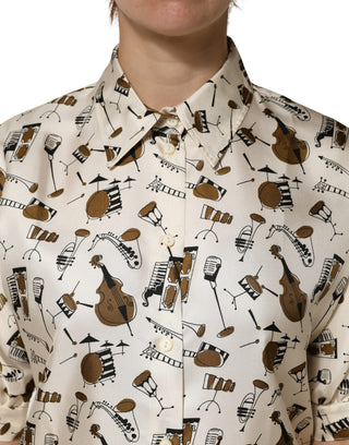 Top beige de manga corta con estampado de instrumentos musicales