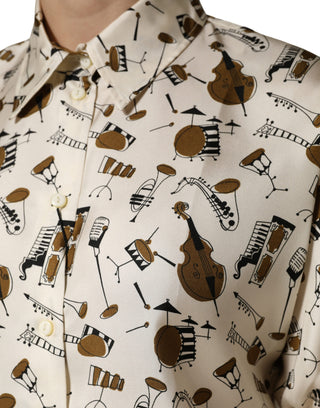 Top beige de manga corta con estampado de instrumentos musicales