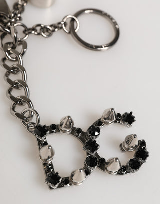 Schlüsselanhänger aus Silber, Messing, Metall mit DG-Logo und Kristall