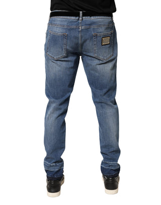 Jeans de mezclilla ajustados de algodón azul desgastados