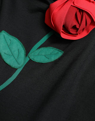 Vestido sin mangas de lana negra con aplique de rosa  