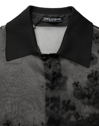 Camisa negra transparente de manga corta con aplique floral