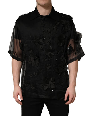 Camisa negra transparente de manga corta con aplique floral