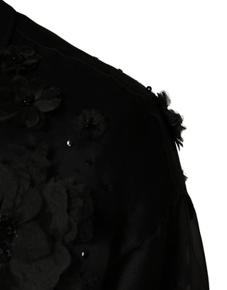 Camisa negra transparente de manga corta con aplique floral