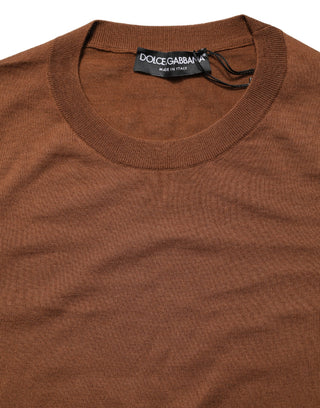 Brown sweater with Dolce & Gabbana label on a white background
