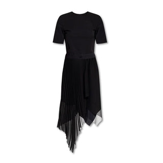 Black dress with a pleated skirt on a white background