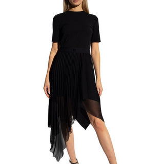 Black dress with sheer overlay on a white background