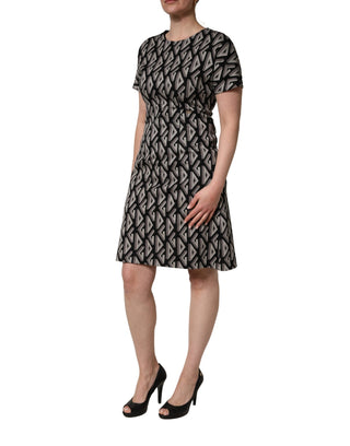 Vestido de algodón negro con estampado de logo hasta la rodilla