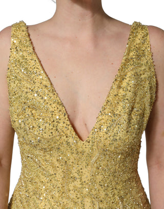 Vestido sirena dorado con escote en V y lentejuelas