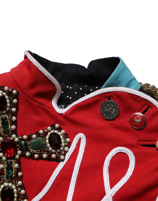 Chaqueta corta asimétrica multicolor con joyas ornamentales  