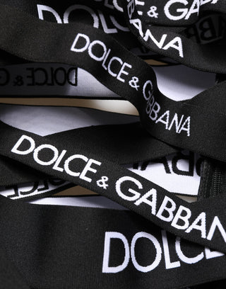 Pantalones ajustados negros de cintura alta con cinta de logo y recortes  