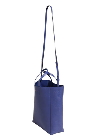 Bolso tote azul con detalles dorados