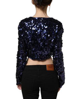 Blusa corta azul con mangas largas y lentejuelas