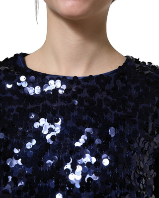 Blusa corta azul con mangas largas y lentejuelas