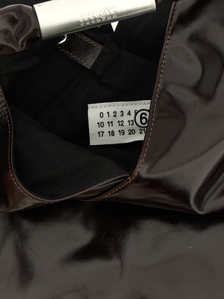 Bolso de mano marrón de cuero de vaca