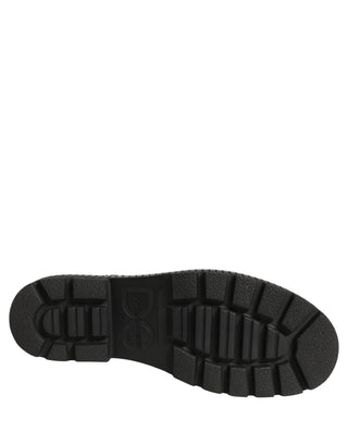 Botas de cuero negro con parche hasta media pantorrilla