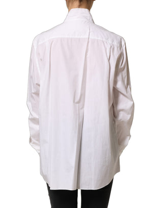 Blusa blanca con volantes y manga larga