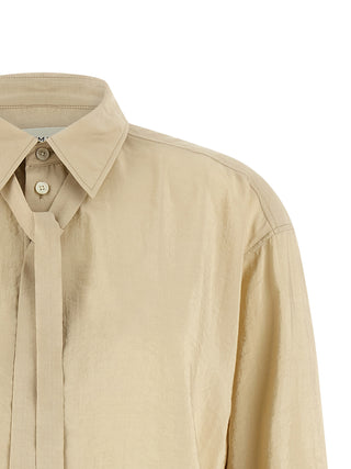 Blusa de seda beige