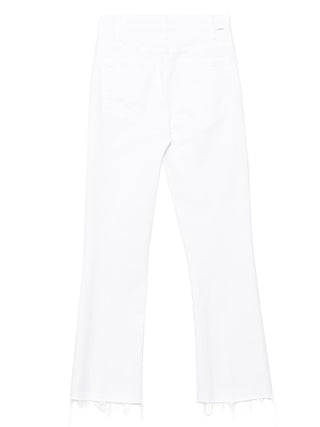 Jeans acampanados de algodón blanco