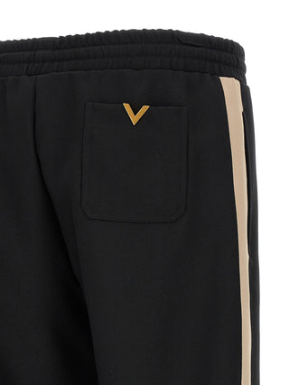 Pantalones deportivos negros de poliéster