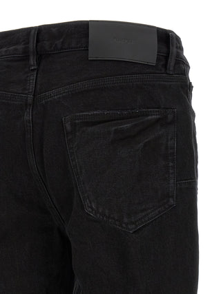 Jeans acampanados de algodón negro
