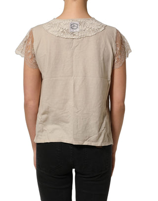 Top beige de algodón con detalles de encaje y cuello redondo