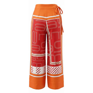 Pantalón naranja de seda para mujer