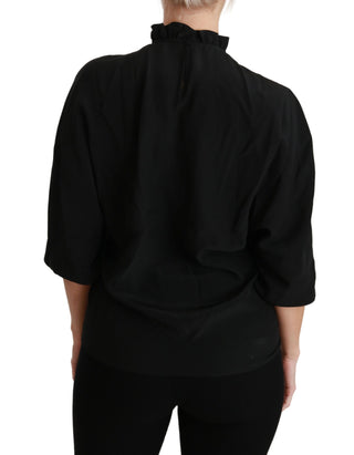 Blusa de seda negra con camisa y volantes