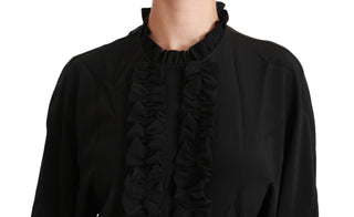 Blusa de seda negra con camisa y volantes
