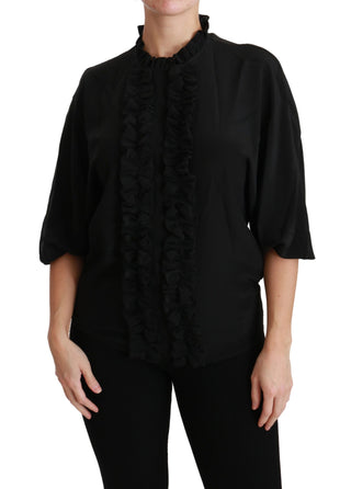 Blusa de seda negra con camisa y volantes
