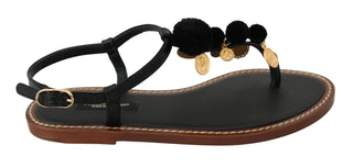 Schwarze Leder-Flip-Flops mit Münzapplikation