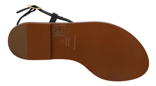 Schwarze Leder-Flip-Flops mit Münzapplikation