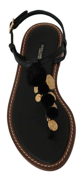 Schwarze Leder-Flip-Flops mit Münzapplikation