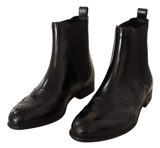 Schwarze knöchelhohe flache Stiefel aus Leder