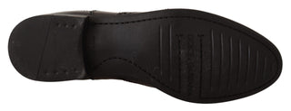 Schwarze knöchelhohe flache Stiefel aus Leder