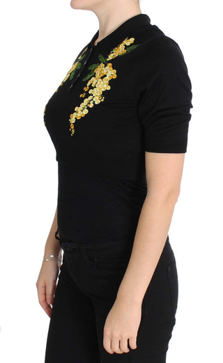 Top de polo de seda negra con bordado floral