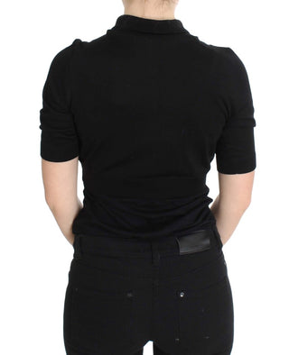 Top de polo de seda negra con bordado floral