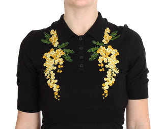 Top de polo de seda negra con bordado floral