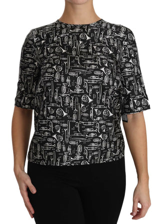 Schwarze Bluse aus Seide mit Aufdruck von Musikinstrumenten