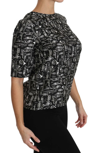 Schwarze Bluse aus Seide mit Aufdruck von Musikinstrumenten