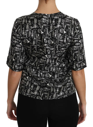 Schwarze Bluse aus Seide mit Aufdruck von Musikinstrumenten